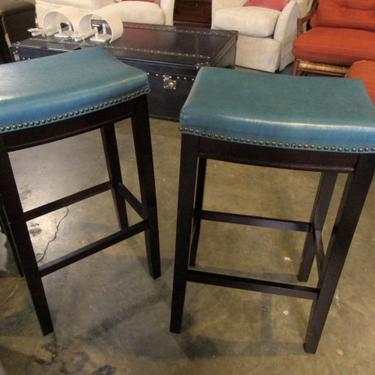 PAIR OF BARSTOOLS IN GREEN LEATHER