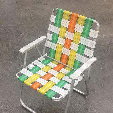 Vintage Lawn Chair Retro 1970s Mid Century Modern + Silver Aluminum Frame + Webbed Seat + Green + Yellow + Orange + Metal Armrests + Folds 