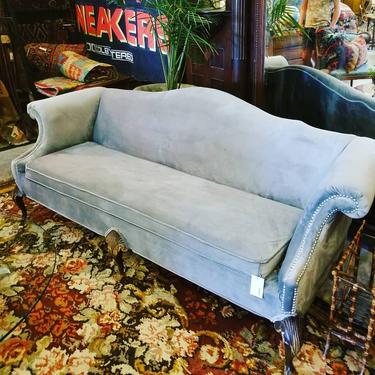 Grey velvet sofa with metal stud work.   $1,200. 