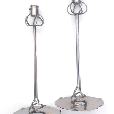 a graceful pair of french art nouveau style chrome-over-brass plated candlesticks