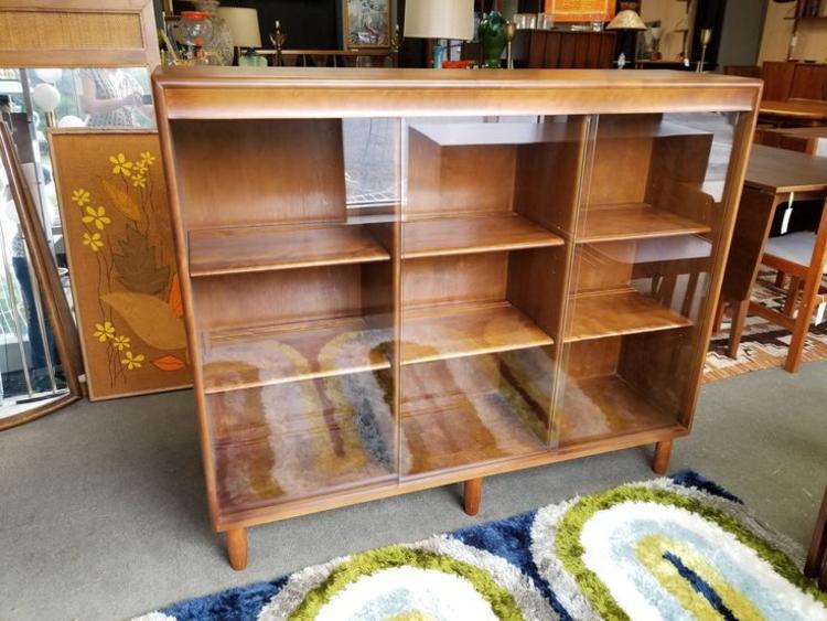                   Mid-Century Modern bookcase with sliding glass doors