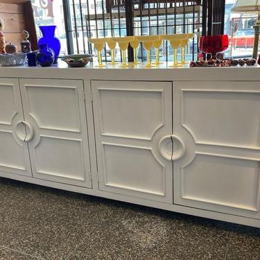 White painted credenza Shelves are stationary. 90.25” x 16”