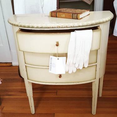 Swedish antique side table or nightstand, painted in cream color with three drawers
