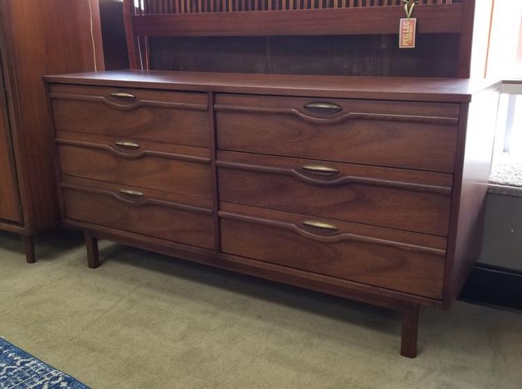                   Mid-Century Modern walnut dresser with sculpted fronts