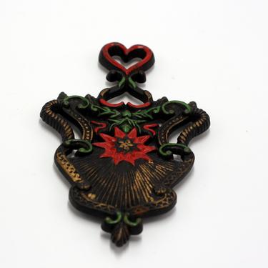 vintage wilton iron trivet with hearts and poinsettia 
