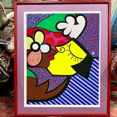 Signed and numbered Romero Britto framed print today. 38” x 32”