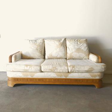 Vintage Floral Sofa with Rattan Accents