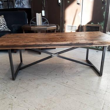 Industrial coffee table with salvaged wood from a boxcar. 