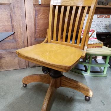 Vintage 1954 Oak Rolling Chair