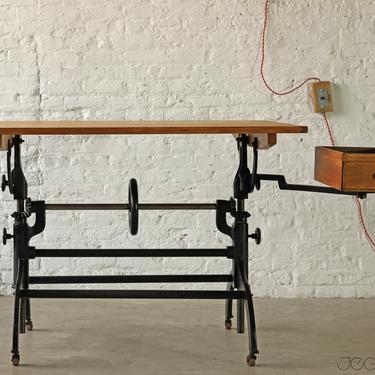 rare vintage industrial cast iron base drafting table by Hamilton MFG Co complete with tool box on swing-out arm and casters 