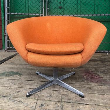 Mid century modern swivel club chair in orange