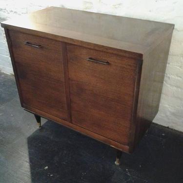 Danish Modern walnut mini credenza/storage cabinet has just arrived.  Beautiful wood grains,  handsome metal pulls and lots of interior storage  make this great for a flat screen,
