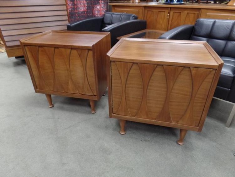 Pair of Mid-Century Modern nightstands with sculpted oval details
