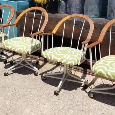 Set of 4 1970s, wood and metal on casters, dining chairs.