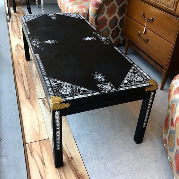                   Super cool black and white stenciled coffee table with brass details! $225!