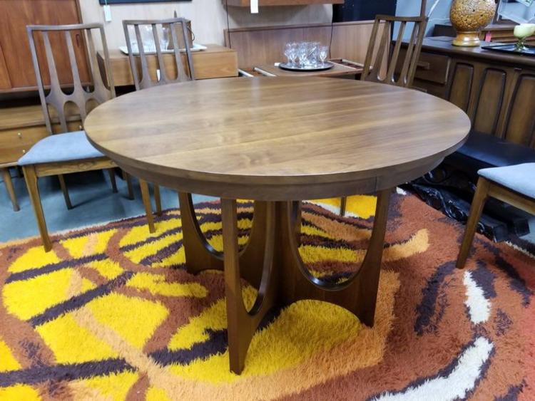 Mid-Century Modern round walnut dining table from the Brasilia collection by Broyhill