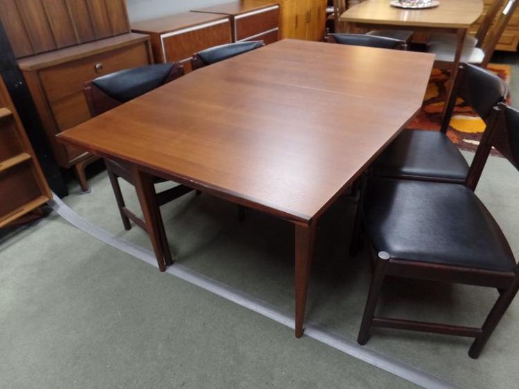 Mid-Century Modern boat-shape walnut dining table with rosewood accents