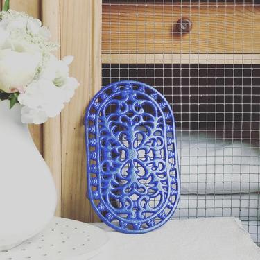 Beautiful vintage French blue iron trivet in oval shape 