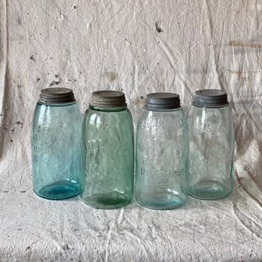 Set of 4 Varying Half Gallon Antique Blue Jars with Lids 