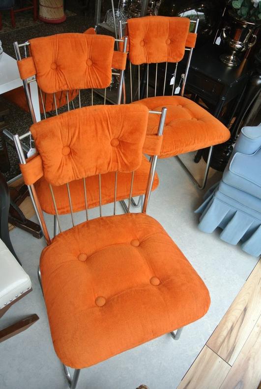                   Orange and chrome chairs. $35/each