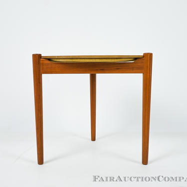 Small teak side table with a reversible top