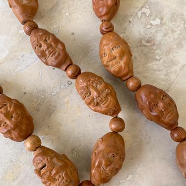 Antique Chinese Hediao Olive Pit Carved Face Beads, Circa 1950s 