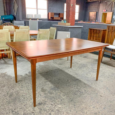 Danish teak dining table with two pull out leaves