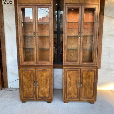 Pair of C. 1970s Campaign Style Tall 2-Piece Lighted Cabinets by Henredon 
