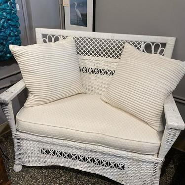 White wicker loveseat with pillows, 40”L x 21”W x 35”T