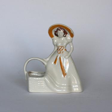 vintage ceramic lady with basket planter made in USA 