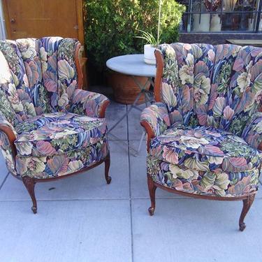 Pair of channel, high-backed arm chairs with floral print upholstery