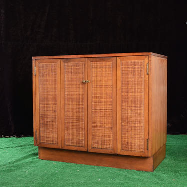 vintage MCM wood cabinet with wicker cane panels 