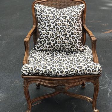 Beautiful vintage cane armchair with fun cheetah cushion and pillow 
