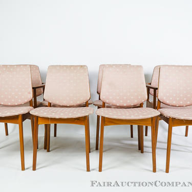 A set of 8 teak dining chairs