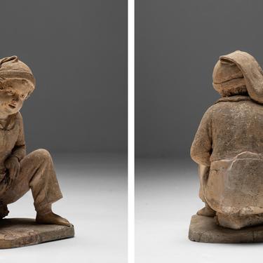 Terracotta Sculpture of a Young Fisherman Playing Marbles