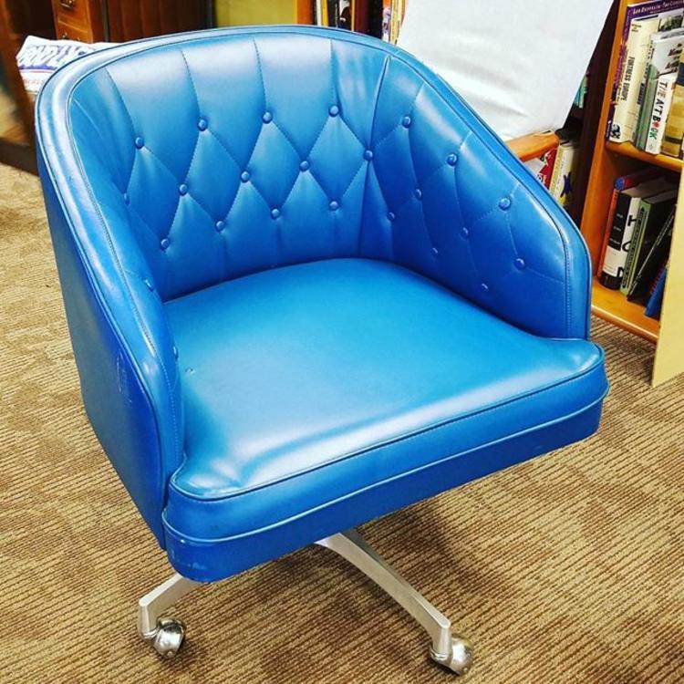 Mid-century chairs. Blue vinyl, tufted on swivel base. Several available.