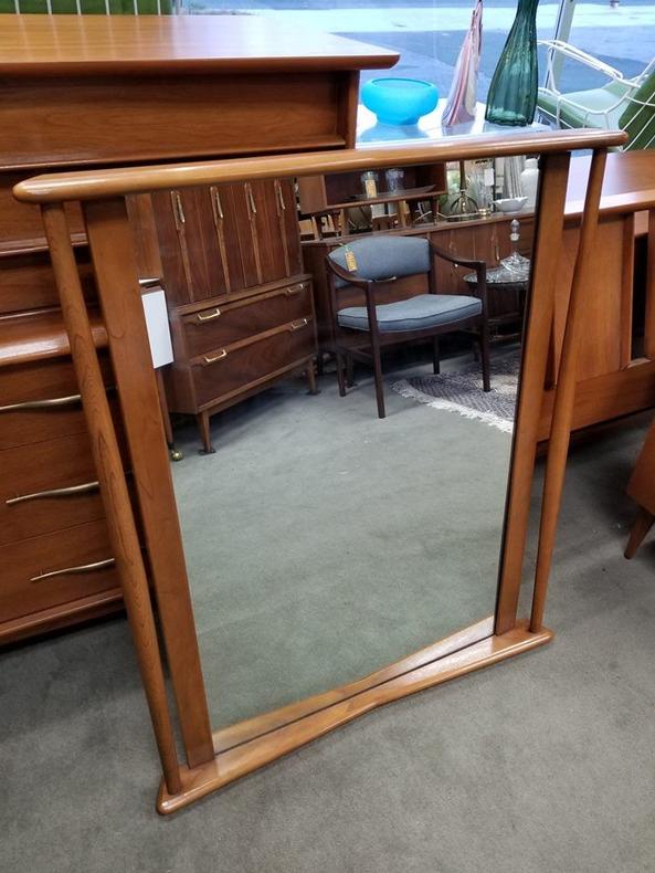 Mid-Century Modern walnut mirror with bowed accents