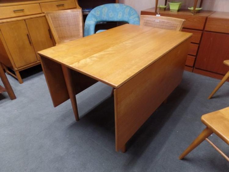 Mid-Century Modern solid birch drop-leaf dining table with two additional drop-in leaves from the Modern Mates collection by Conant Ball