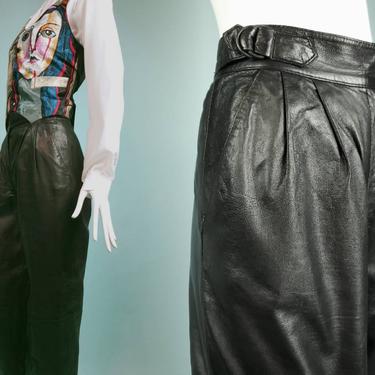 Vintage 80s black leather pants. High rise & tapered leg. (26×30) 