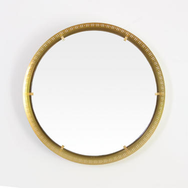 Scandinavian Modern round pierced brass mirror.
