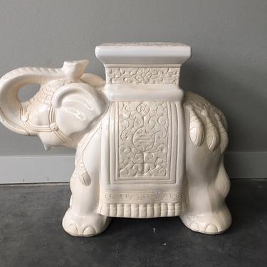 white ceramic elephant plant stand