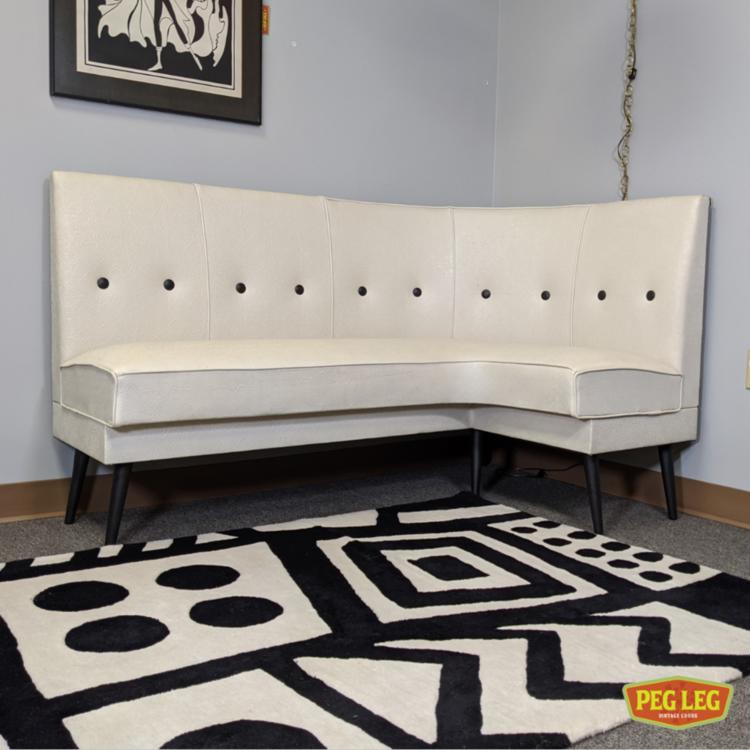 Mid-Century Modern vinyl banquette with tapered legs