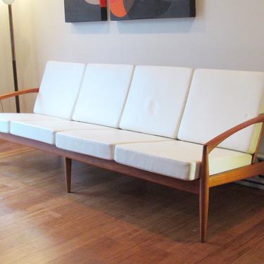 Kai Kristiansen 'Paperknife' four-seat Danish teak sofa w/white naugahyde cushions 