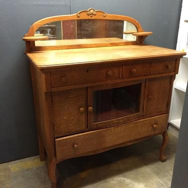 Unusual vintage oak dresser with glass front compartment. Looks like it was used for millinery. In very good condition.
