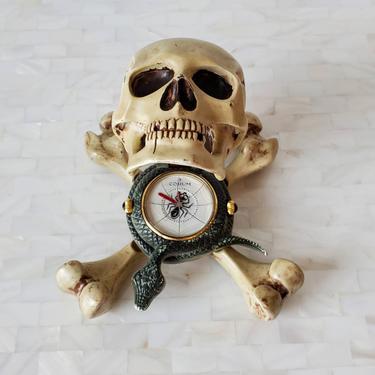 Rare Corum Jolly Roger Skull & Crossbones Enameled Metal Sculptural Alarm Desk Clock / Travel Table Clock, circa 2005, 3.101.25 