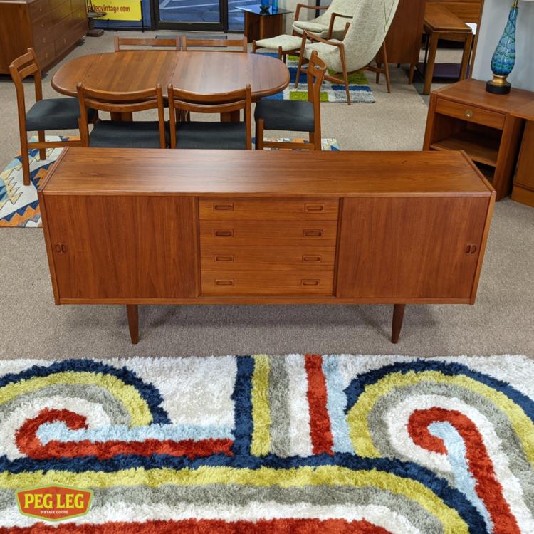 Danish Modern teak credenza with sliding doors and sculpted pulls