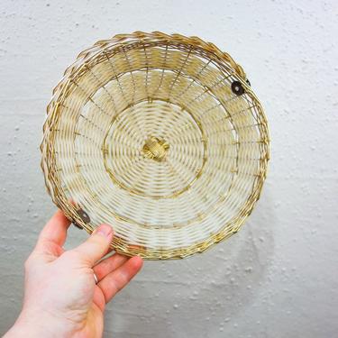 Vintage white and gold 8" woven basket with handle, brass wire and plastic wrapped unique organizer bowl, decorative metal catch all tray 