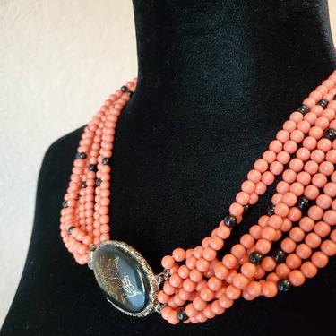 Vintage necklace multi strand orange and black with  floral pendant 