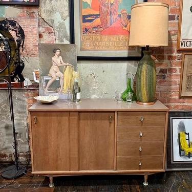 Midcentury modern credenza with sliding cabinet storage and drawers