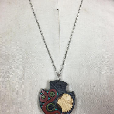 1970s pendant, novelty pendant, carved necklace, ethnic style, face necklace, hippie necklace, boho jewelry, resin pendant 